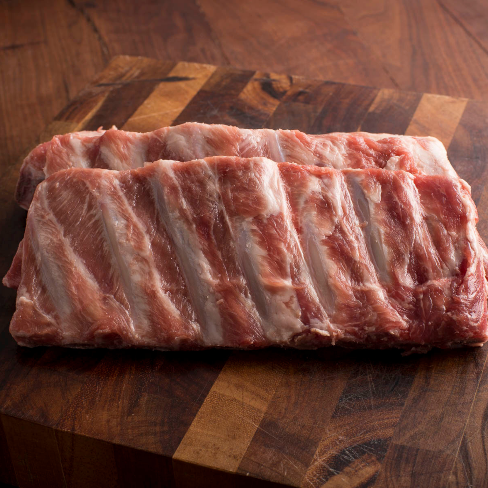 Grass roots Farmers' Co-op Pork Spare Ribs: St. Louis style pork spare ribs are meatier and have more fat marbling and flavor than baby backs. Their richness pairs beautifully with a sweet or tangy barbecue sauce, or  prepared simply with a seasoned dry rub. The classic cooking method for St. Louis-style spare ribs is to smoke or grill them low and slow, you can also slow cook them in the oven to achieve that sought-after fall-off-the-bone tenderness. -Weight app. 2.5–3 lbs.